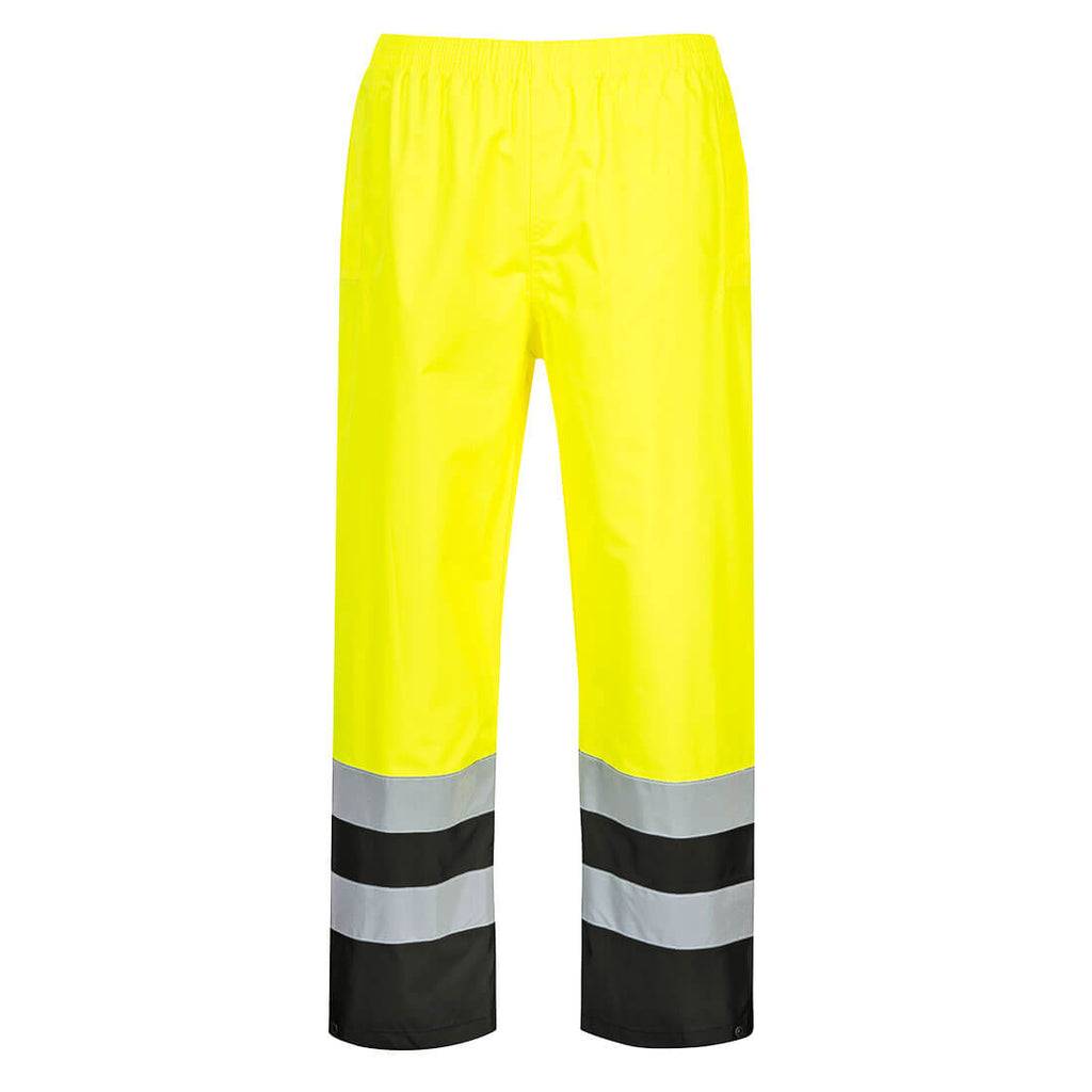 High-visibility yellow work pants with reflective stripes, black at ankles on a white background